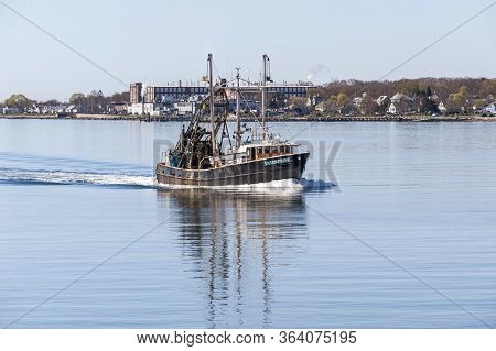 New Bedford, Massachusetts, Usa - April 29, 2020: Clammer Enterprise Passing Factory On New Bedford 