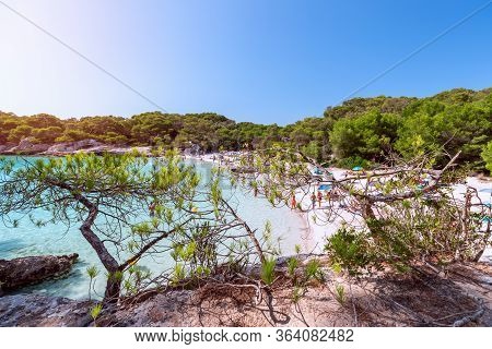 View Of The Famous Beach Cala Turqueta. (focus On Foreground, People On The Beach In Blur). Menorca,