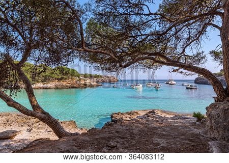 Seascape View Of The Famous Bay Cala Turqueta With Boats On The Sea. Menorca, Balearic Islands, Spai