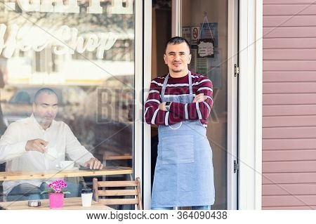 Small Business Owner Smiling At Entrance Door For Reopening Of Street Coffee Shop After Lockdown Qua
