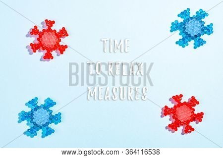 Words Time To Relax Measures With Coronavirus Models On Blue Background. Concept Of Relaxing Restric