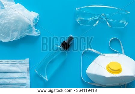 Medical Protective Mask, Respirator Ffp, Rubber Gloves, Antiseptic And Protective Glasses Lie On A P