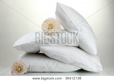 pillows and flowers, on grey background