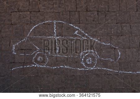 Square Cobbles In Lines. Natural Stone Textured Background. The Machine Is Drawn In Chalk On The Pav