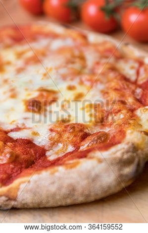 Vertical Closeup Shot Of An Italian Pizza Margherita With Tomato Souce And Mozzarella Di Bufala Chee