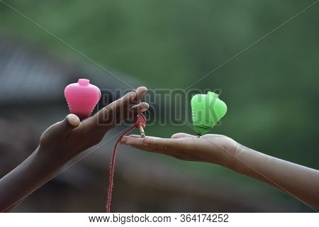 Kids Play Lattu Or Lattu On The Hand