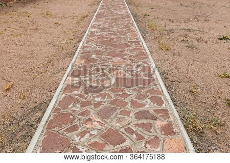 Akyrtas Palace Complex In Kazakhstan. The Path Of Red Stone On The Territory Of The Complex.