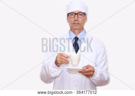 Close-up - A Doctor In A White Coat Holding A Cup Of Coffee In His Hand