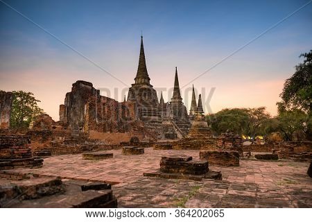 Ruins Of Buddhist Temple Wat Phra Si Sanphet In Ayutthaya At Sunset