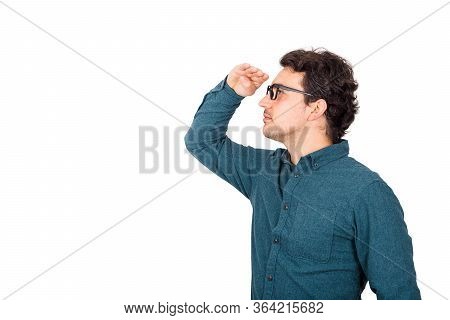 Confident Businessman Looking Attentive Far Away Ahead, Holding Hand To Forehead Over Eyes, Isolated