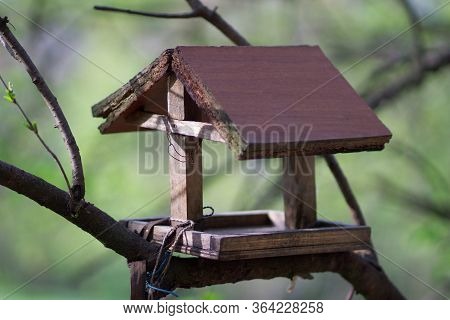 Feeder In The Form Of A House For Birds