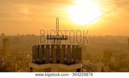 Silhouette Of A Brave Man On The Roof Of A Skyscraper