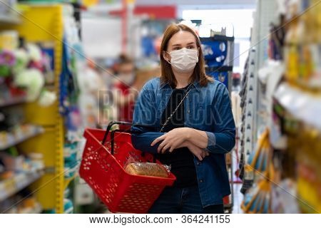Woman Buyer Wearing A Protective Mask.shopping During The Pandemic.emergency To Buy List.panic Buyin