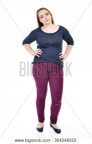 Overweight young woman, over white background. Diet, fitness, excess weight, growing thin, sedentary life, balanced nutrition, overeating, cellulitis, problem of overweight concept. 