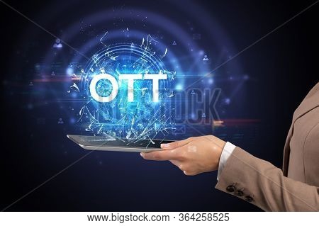 Close-up of a touchscreen with OTT abbreviation, modern technology concept