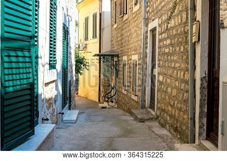 Winding Street Of The Authentic, Old Town Of Herceg Novi, Montenegro. We See Old Houses And Very Nar