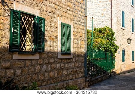 Winding Street Of The Authentic, Old Town Of Herceg Novi, Montenegro. We See Old Houses And Very Nar