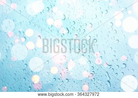 Water Drops On Glass Window With Bokeh Lights