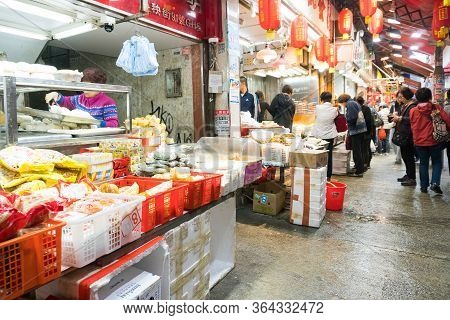 Hong Kong,march 24,2019:people Among The Classic Markets In The Narrow And Crowded Streets Of Hong K