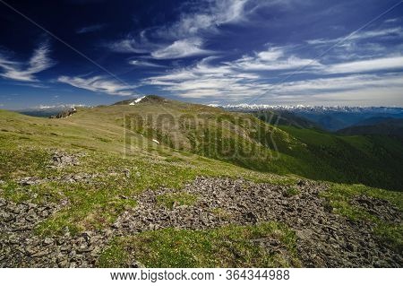Spectacular View From The Top Of The Mountain To The Mountain Slopes And Meadows In The Ulagansky Di