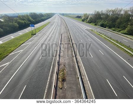 A Motorway In The Uk Is Deserted During The Coroanvirus Outbreak