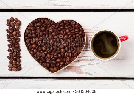 I Love Fresh Strong Coffee Concept. Roasted Coffee Seeds In A Shape Of Letter I And Heart. White Woo