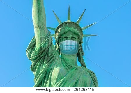 Close Up Of Statue Of Liberty With Surgical Mask, Symbol Of New York City At Time Of Covid-19 Isolat