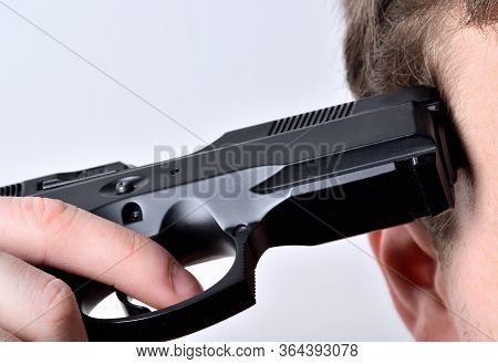 Pistol At The Head - A Man Committing Suicide By Handgun- Close-up Detail