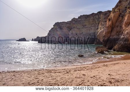 Empty Beach Between Cliffs. Uncrowded Travel Concept. Algarve, Portugal