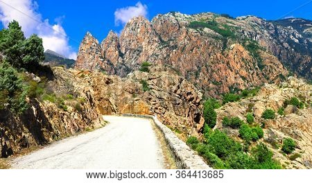 bending roads in high mountains of beautiful Corsica islnad