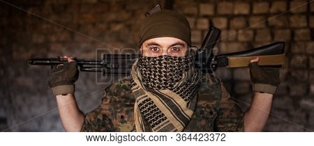 Arab Male Soldier In A Headdress From The National Keffiyeh With Weapons In His Hands. Muslim With F