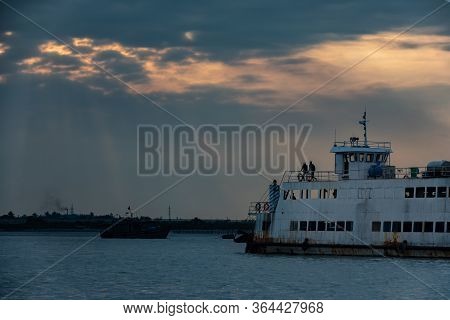 Ferry Crossing From Cat Ba To Halong During Sunset With Golden Sun Rays
