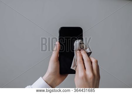 Cleaning The Smartphone Screen With A Fiber Cloth From Dirt Dust And Other External Factors. Mobile 