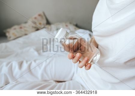 Transparent Bottle Made Of Eco-plastic With Drinking Water In Female Hands.