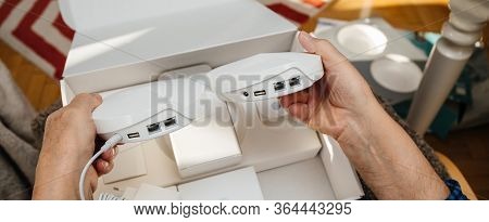 Paris, France - Circa 2020: Senior Hands Unboxing Unpacking New Parcel From Amazon Prime Containing 