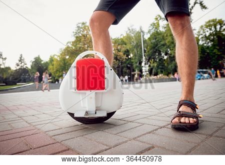 Young Man Driving On Solowheel In The Park.