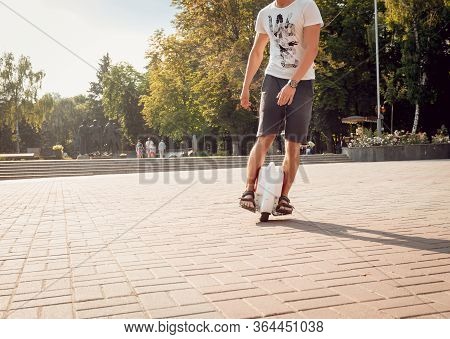 Young Man Driving On Solowheel In The Park.