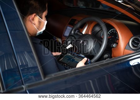 Bangkok, Thailand - April 4, 2020 : Unidentified Car Mechanic Or Serviceman Checking A Car Engine By