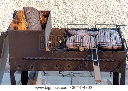 Cooking Kebabs On The Grill. Cooking Meat On A Fire In Nature.