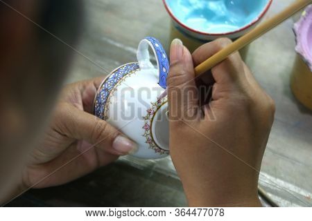 Artist Painting Benjarong Ceramic Ware