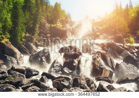 Uchar Waterfall In Altai Mountains, Siberia, Russia. Beautiful Summer Landscape. Famous Travel Desti