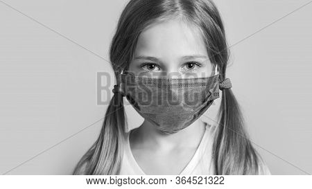 Little Kid Uses Medical Mask Or Surgical Mask To Protect Her From Virus, Sickness, Covit-19 And Coro