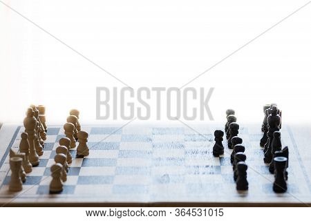 Chess Pieces On The Chess Board With Selective Focus. Business And Motivation Concept. Copy Space