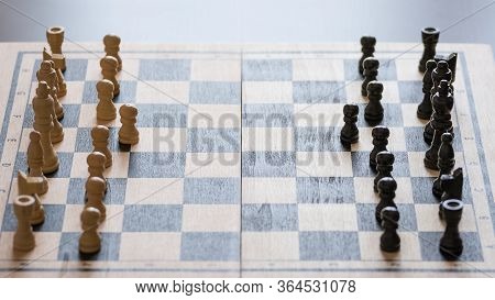 Chess Pieces On The Chess Board With Selective Focus. Business And Motivation Concept.