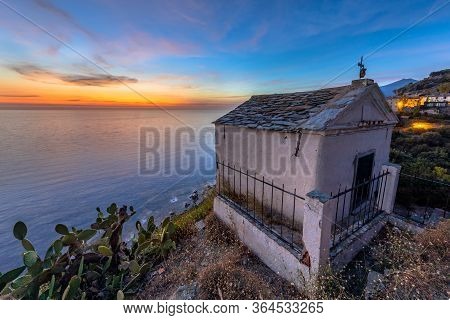 Mountain Village Of Nonza With Chapel And View Over The Mediteranean Sea On Cap Corse Peninsula, Cor