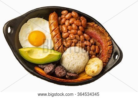 Bandeja Paisa, Typical Dish At The Antioqueña Region Of Colombia. It Consists Of Chicharrón (fried P