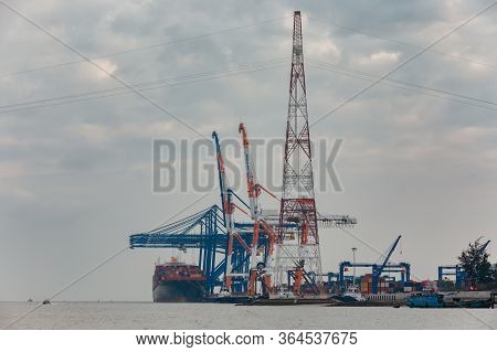 Hai Phong, Vietnam - December 26: Ship Is Loading Containers By Port Cranes On  December 26, 2019 In