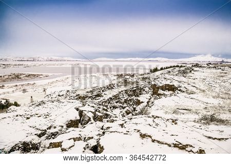 Beautiful view on Silfra rift during winter, the place where Eurasian and the American tectonic plate are divided in Thingvellir National Park, Iceland. 