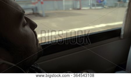 Long Way. Man Sleeping In The Train. People Standing Behind The
