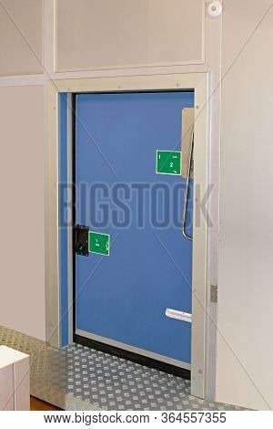 Insulated Blue Door At Reefer Refrigerator Storage Room